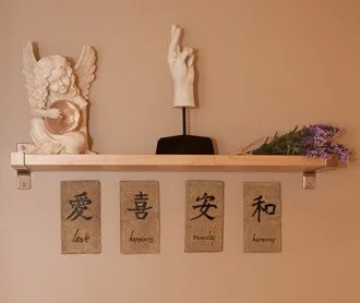 Shelf with decorative figures and engraved tiles