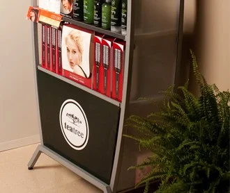 Retail display stand with hair care products